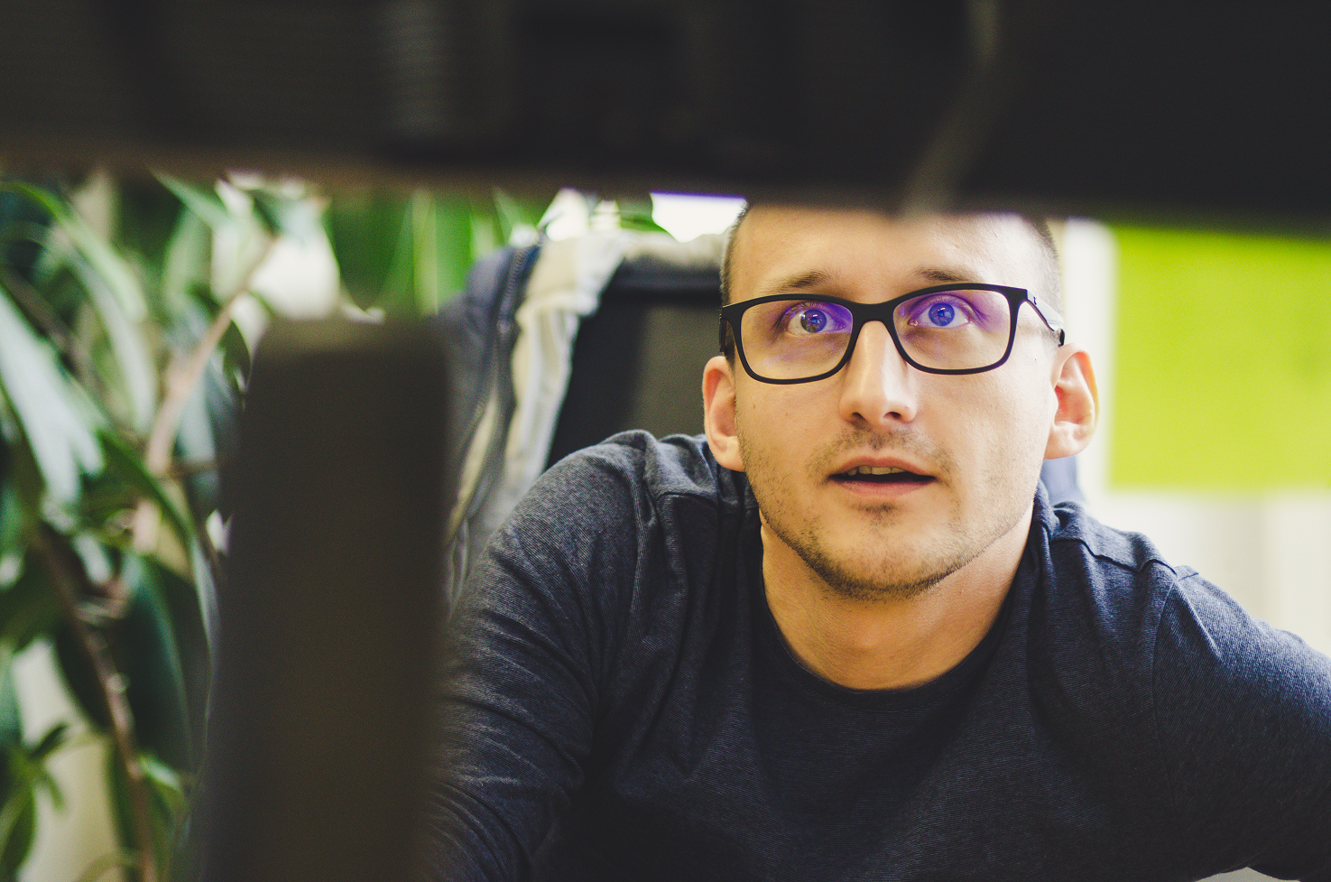 Ricsi is working in our office in front of his monitor.